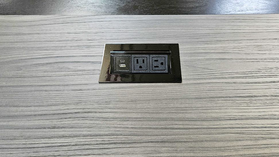U shape conference table close up photo of AV integration and seamless veneer