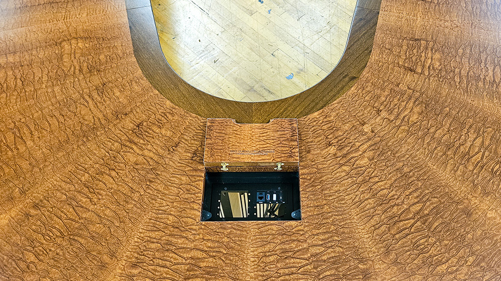 U shape conference table close up photo of AV integration, wood pairing and seamless veneer