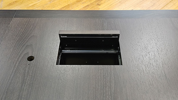 U shape conference table in shop, detailed close up of AV integration
