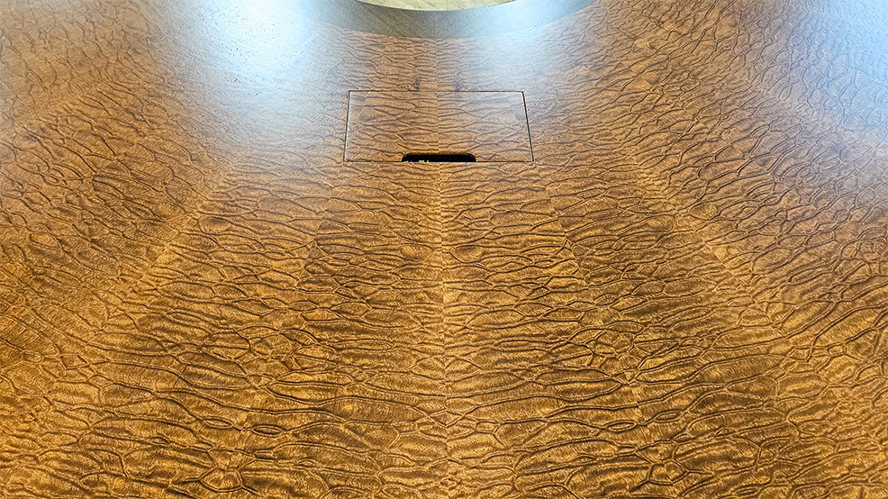 U shape conference table close up photo of AV integration, wood pairing and seamless veneer