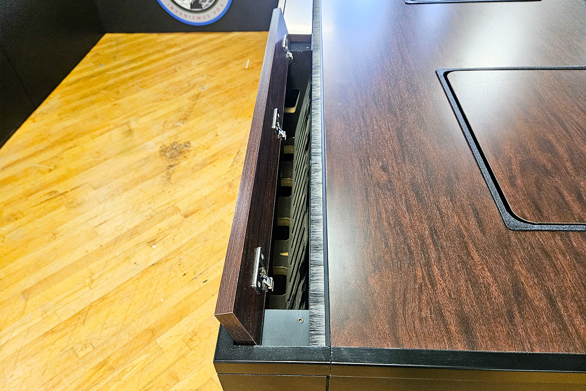 U shape conference table close up photo of AV integration and wire management