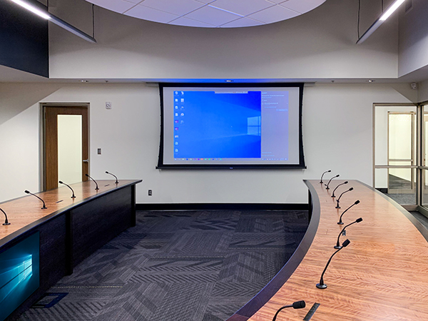 Final table construction with AV integration facing multiple screens
