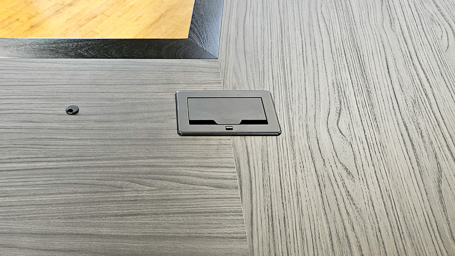 U shape conference table close up photo of AV integration and seamless veneer