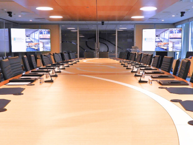 Executive reconfigurable boardroom conference table final installation with AV integration